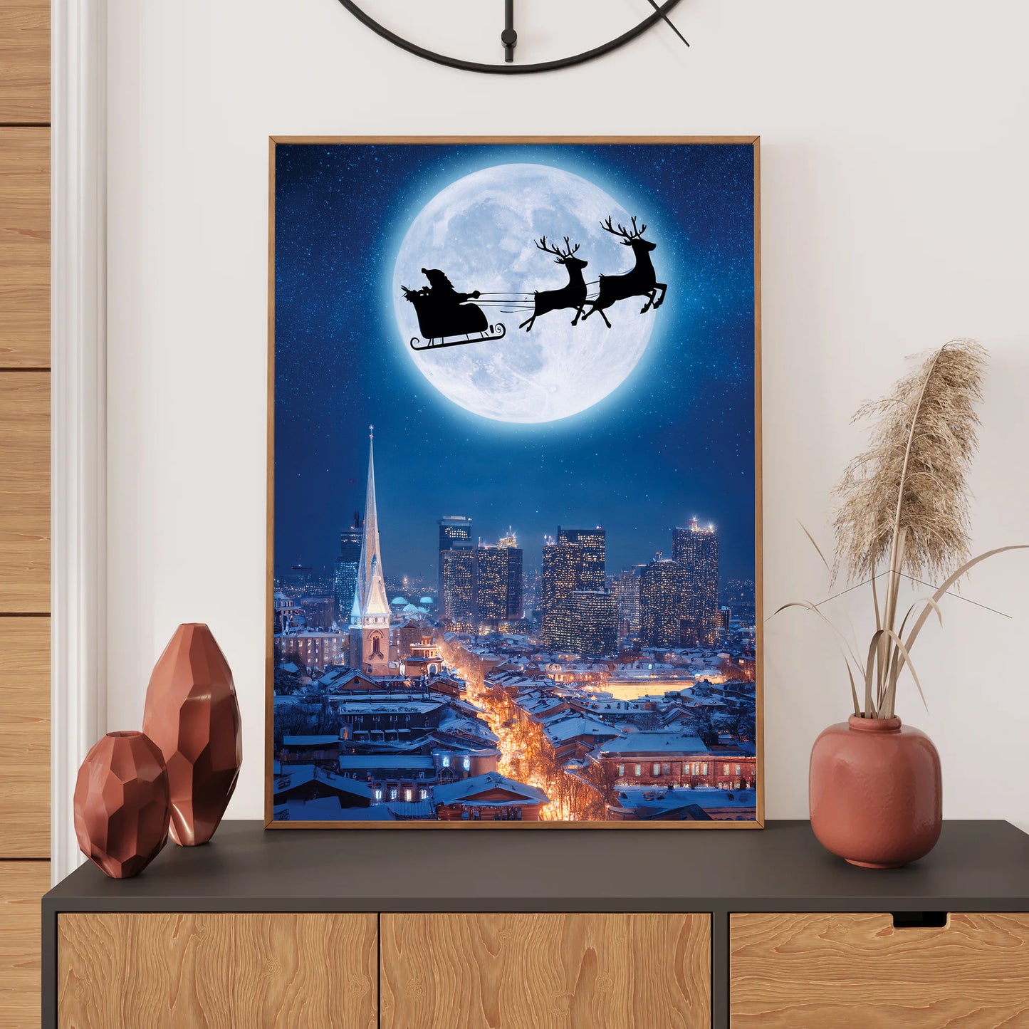 Santa Flying Over City Christmas Card – Santa’s sleigh flying across snowy city skyline under full moon