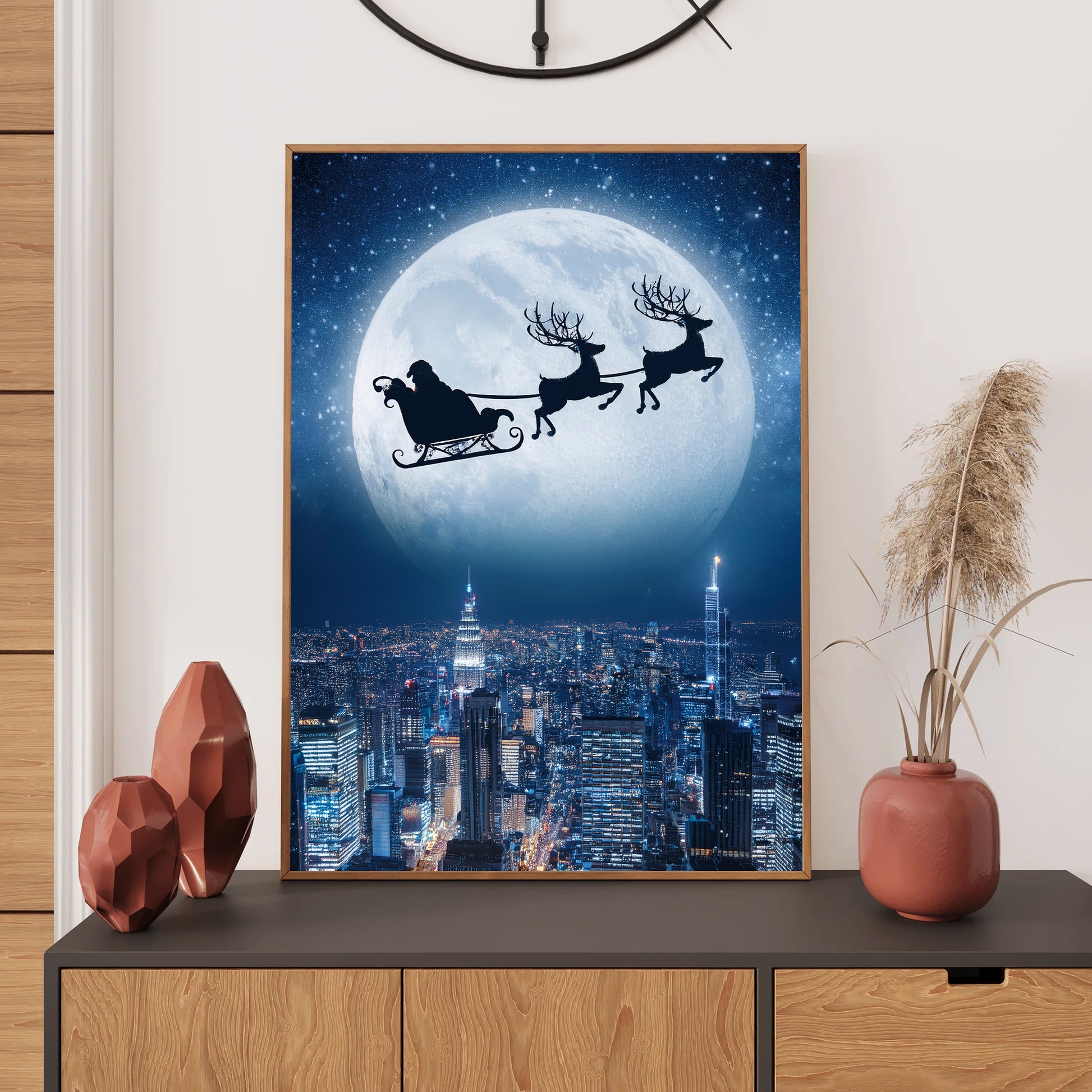 Santa Flying Over City Christmas Card – Santa’s sleigh flying across snowy city skyline under full moon
