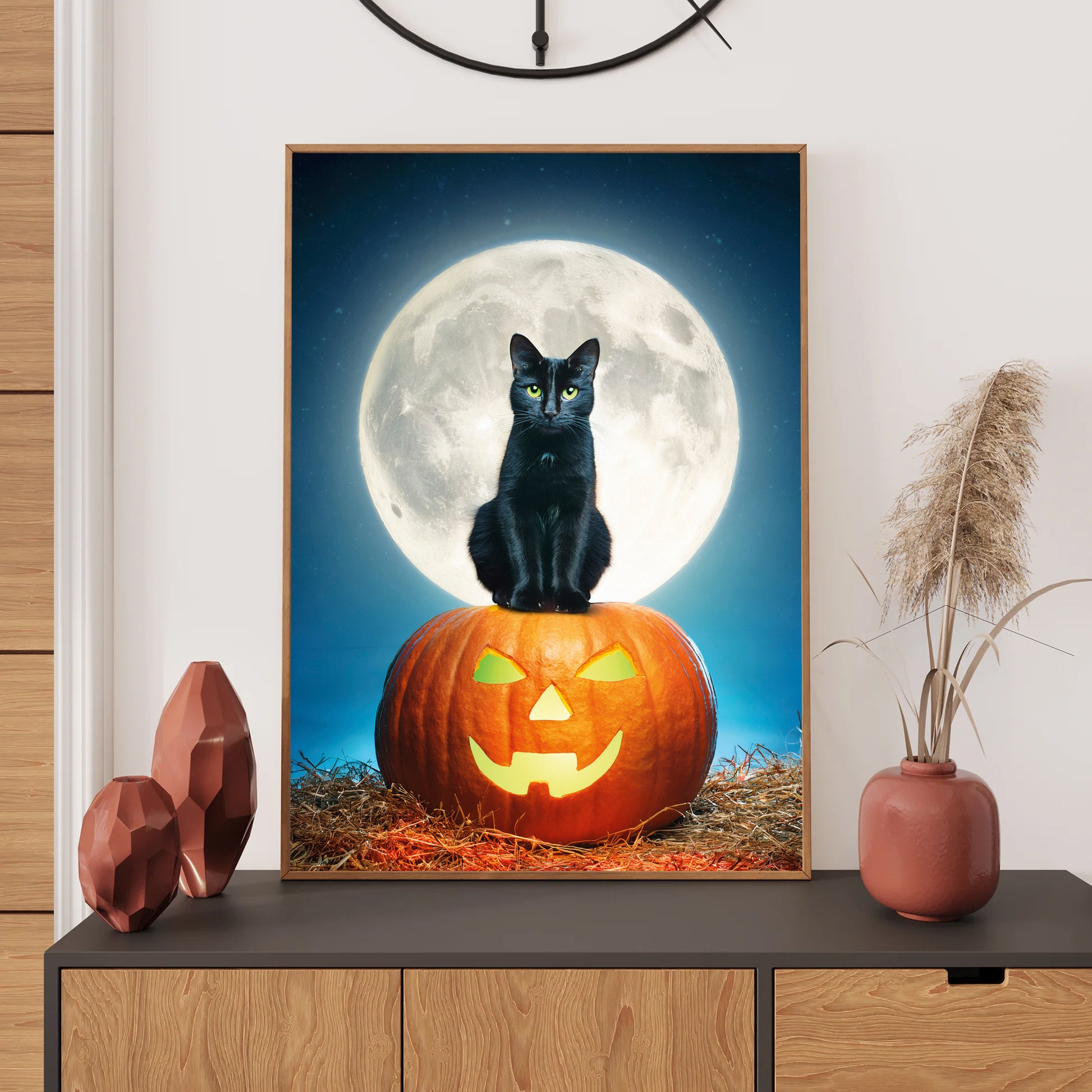 Cartoon gothic black cat with glowing green eyes sitting on a carved pumpkin under a full moon – spooky Halloween art