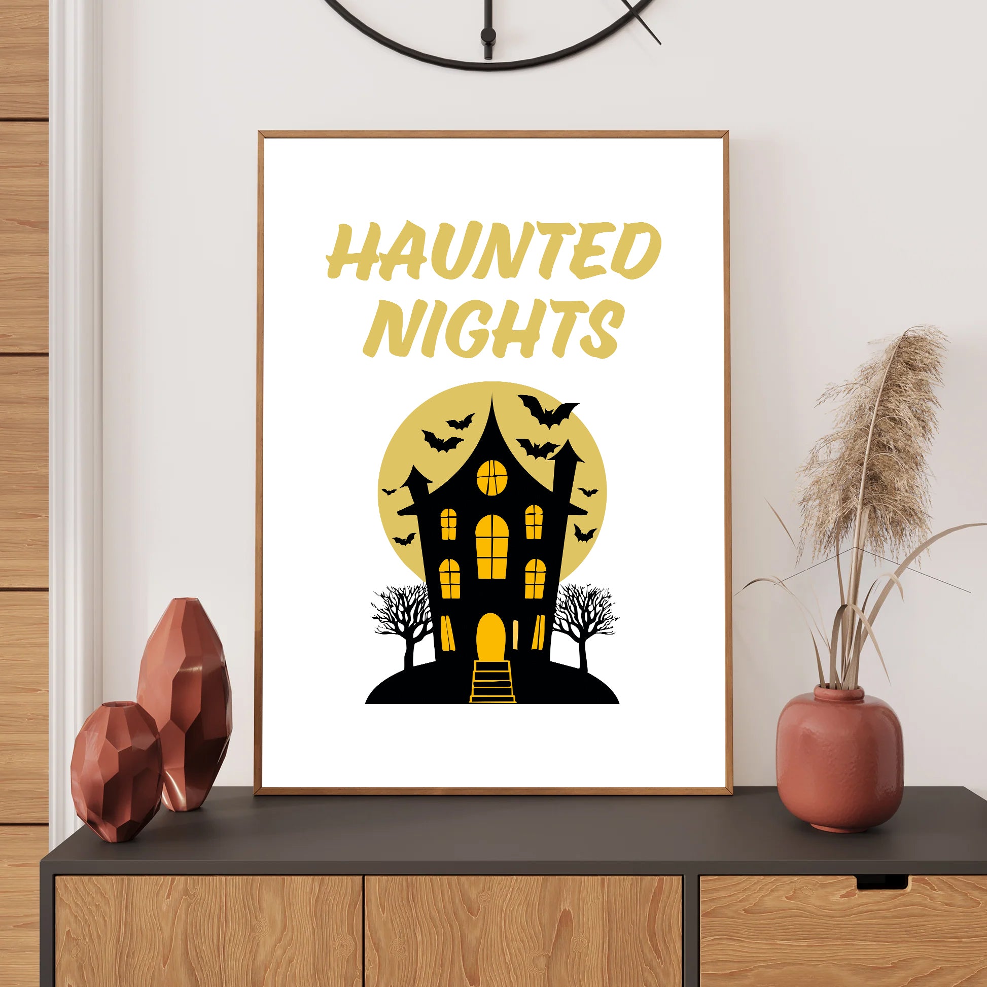 Framed Halloween-themed poster with 'Haunted Nights' text on a wall above a wooden cabinet.