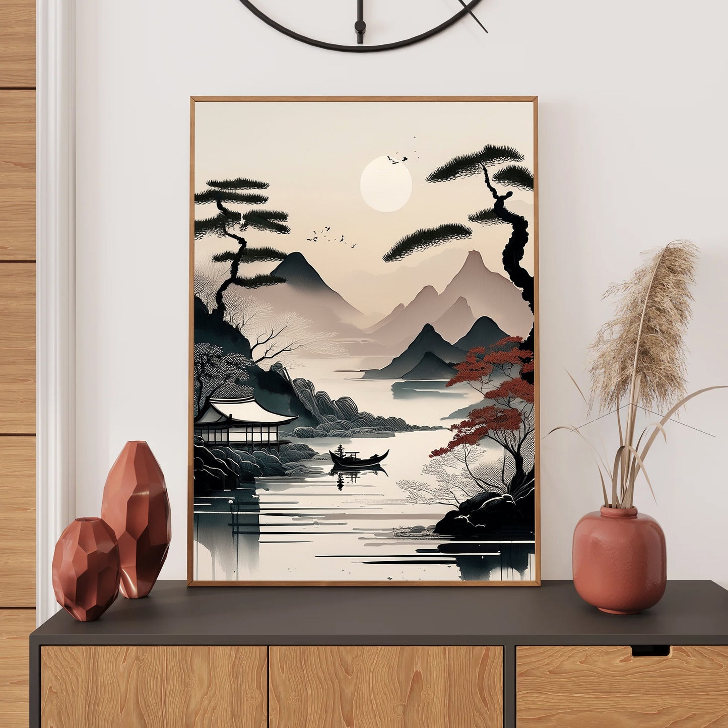 Framed artwork of a mountain landscape with a boat on a table, surrounded by decorative items.