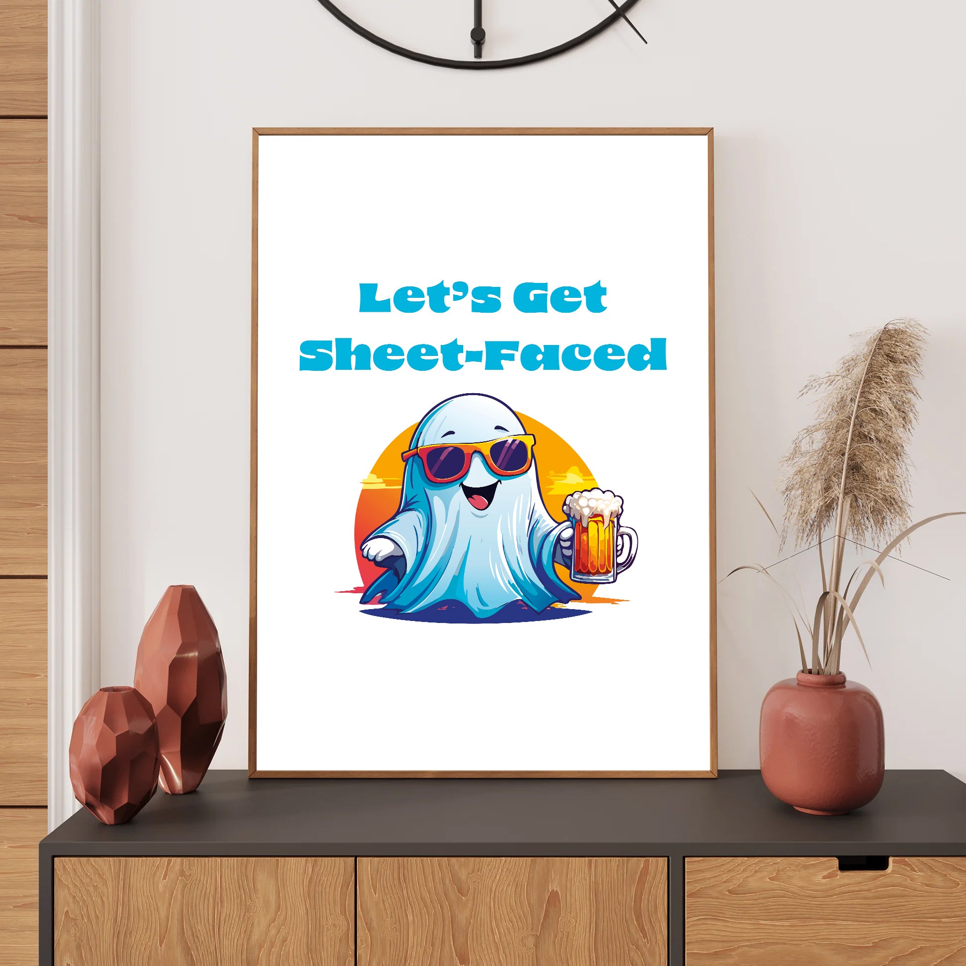 Framed artwork with a ghost character holding a beer and text 'Let's Get Sheet-Faced' on a wall above a shelf.