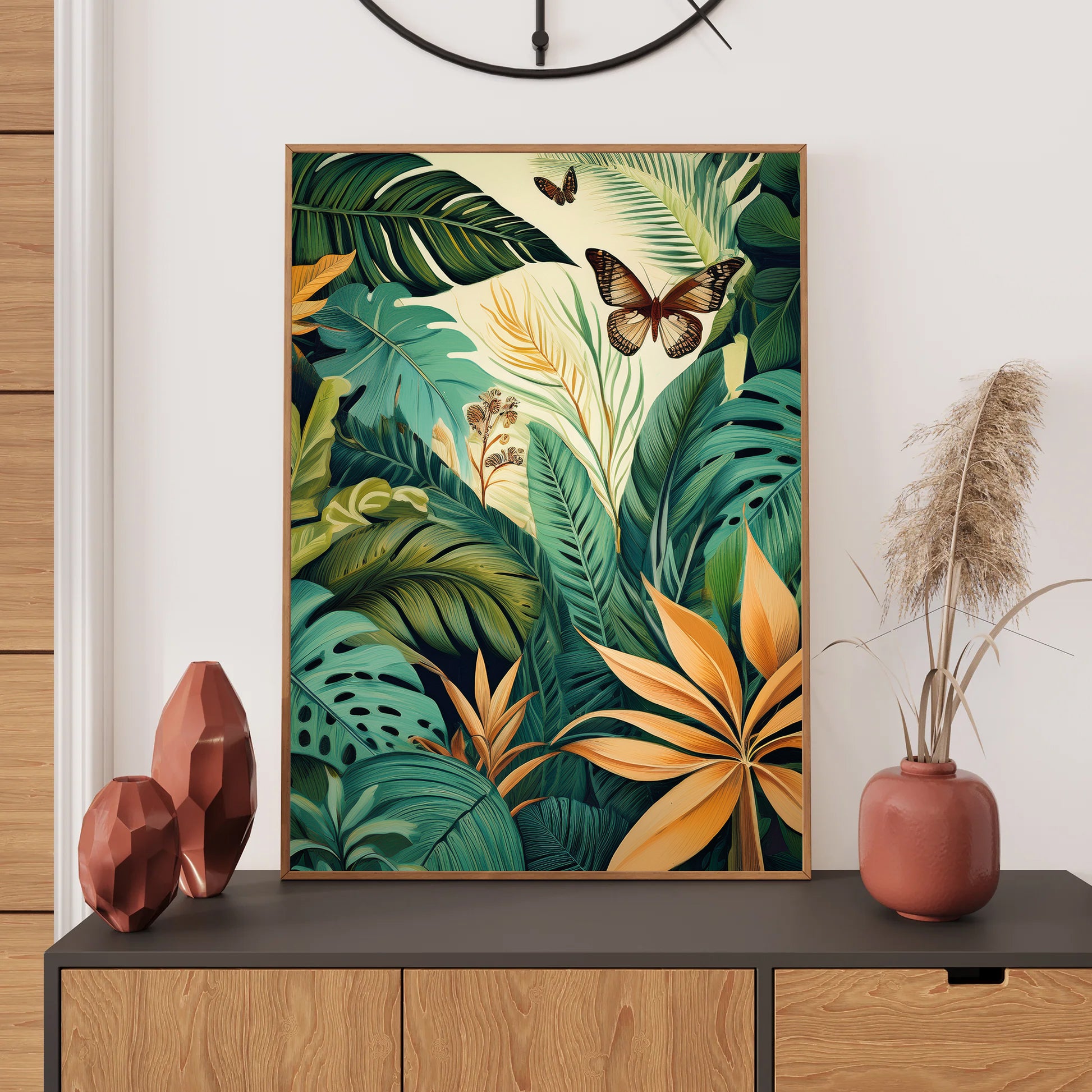 Tropical leaf and butterfly artwork on a wall above a console table with decorative items.