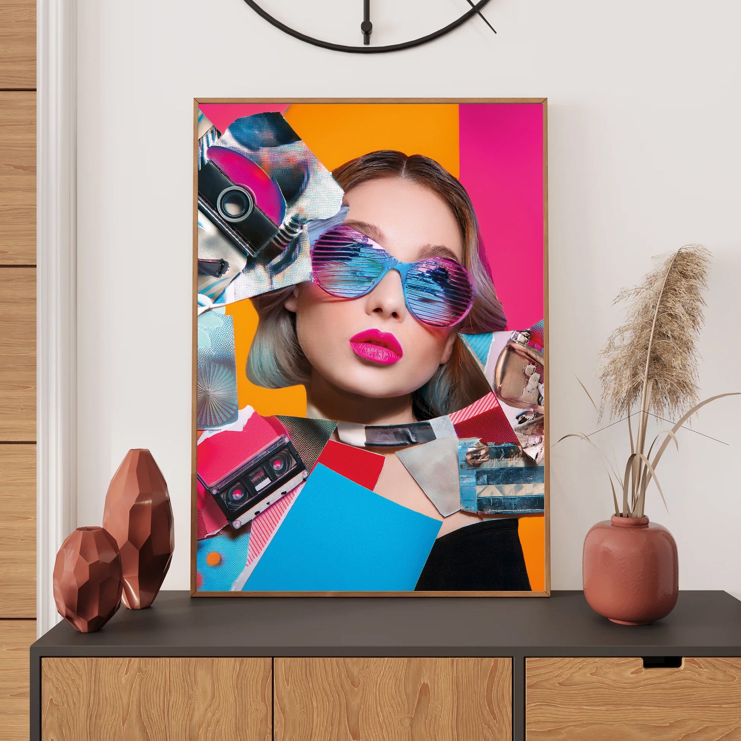 Colorful abstract art print of a woman's face with sunglasses on a wall above a shelf.